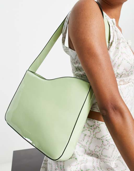 River Island patent asymmetric cut out shoulder bag in light green