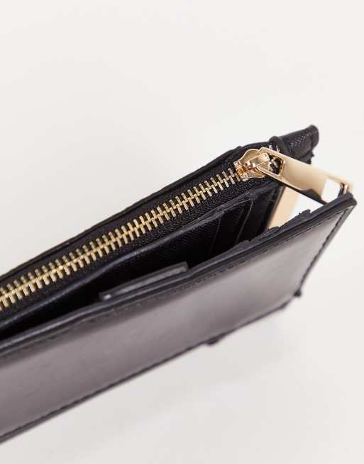 River Island embossed monogram mini zip wallet in black