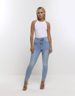 River Island Petite - Figurformende, eng geschnittene Jeans in Blau