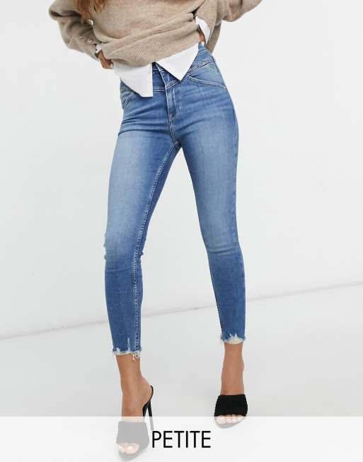 River Island Petite high rise raw hem skinny jeans in mid auth blue ASOS