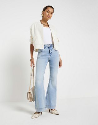 River Island Petite Petite high waisted flared jeans in denim - light