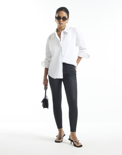River Island Petite Petite mid rise coated skinny jeans in black - view 1