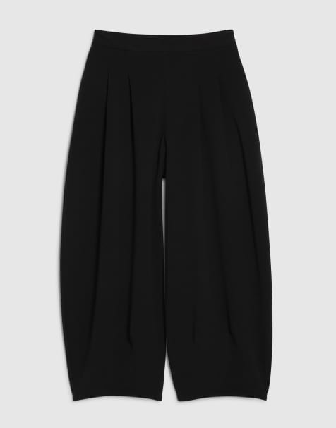River Island Petite pleated balloon leg trousers in black