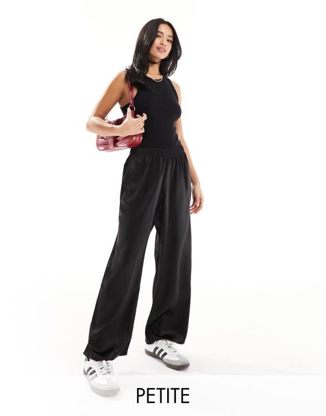 Bershka Petite folded waistband flared trousers in black