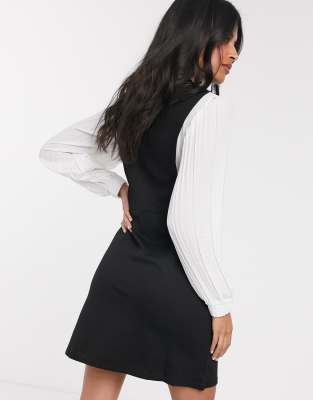 black pleated pinafore dress