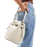 River Island pinched edge bucket bag in cream-White