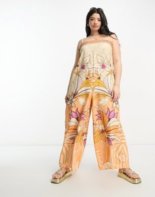 River Island Plus beach jumpsuit in tropical orange print