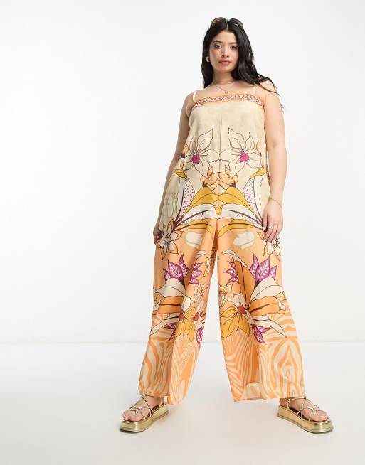 River Island Plus beach jumpsuit in tropical orange print