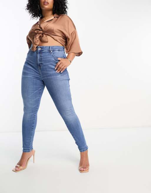 River Island Plus high rise skinny jeans in medium blue