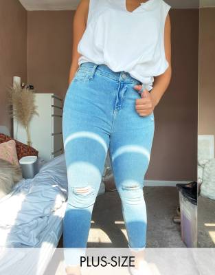 River Island Plus ripped knee raw hem skinny jeans in light blue | ASOS