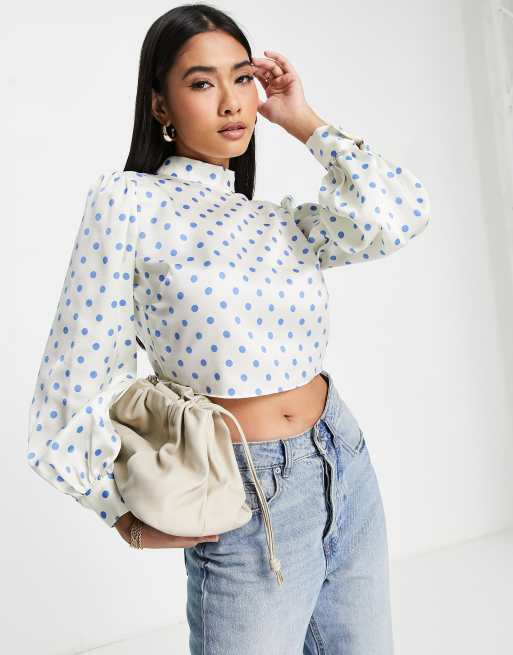 River Island polka dot tie back high neck blouse is blue | ASOS