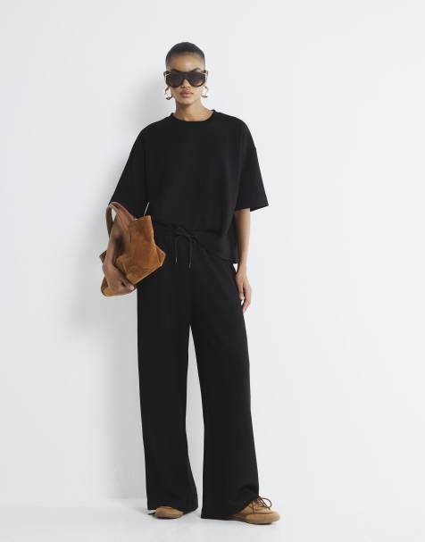 River Island Premium high waisted wide leg joggers in black - view 1