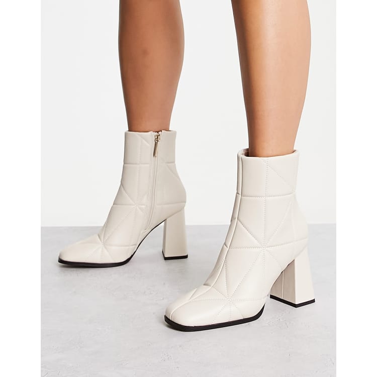 Cream best sale heeled boots