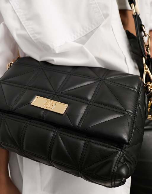 Black quilted crossbody shop bag with gold chain