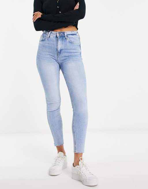 River Island raw hem high waisted skinny jeans in mid blue | ASOS