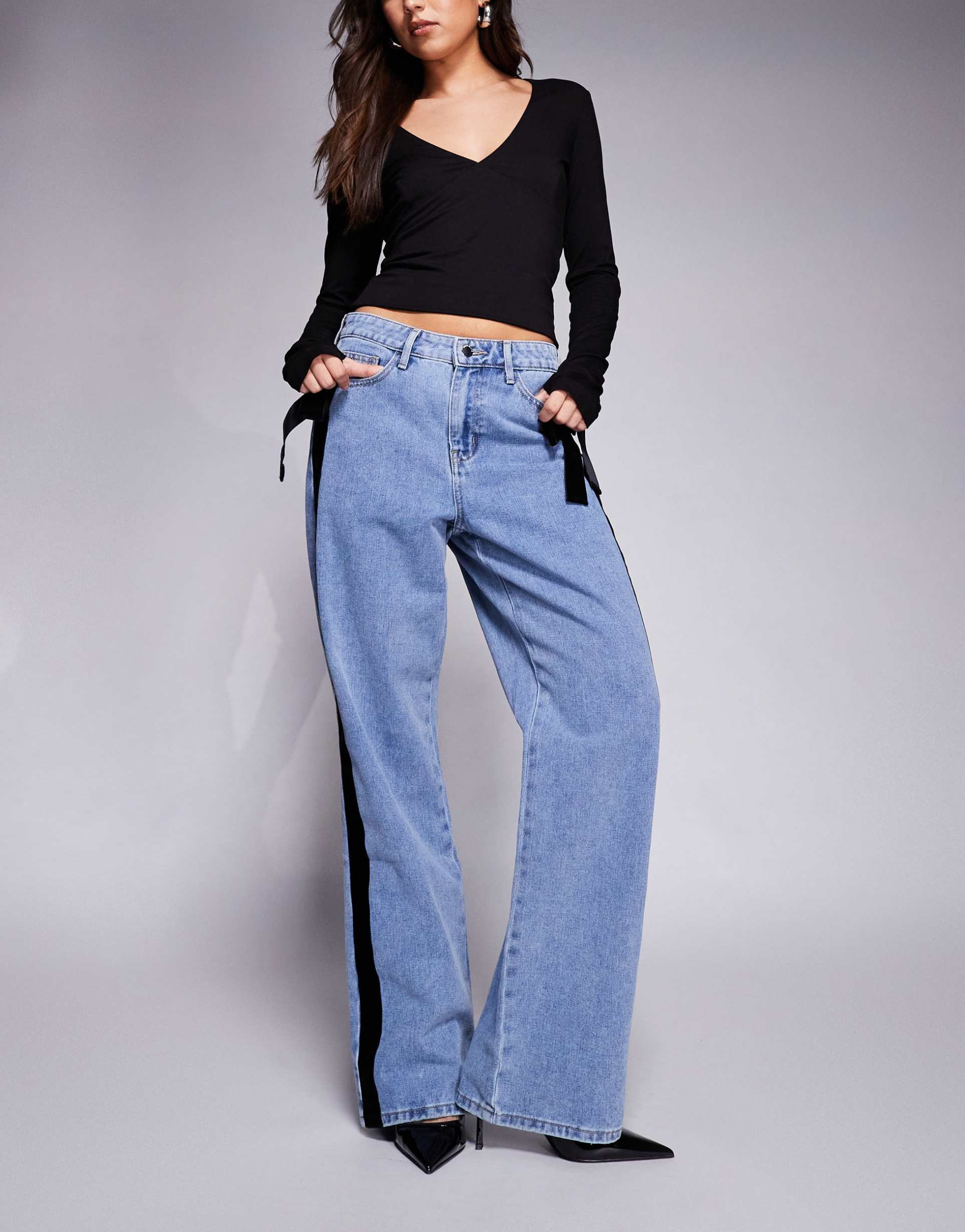 river island relaxed straight leg jeans with velvet bow detailing in midwash blue