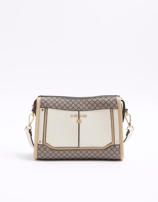 River Island Ri monogram panel cross body bag in cream ASOS