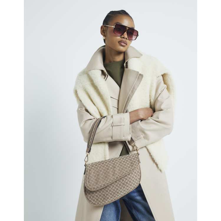 beige ri monogram mini backpack River Island Ri monogram shoulder bag in beige