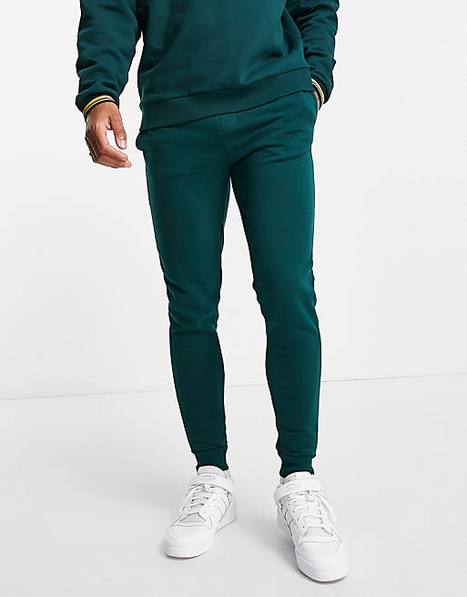 River Island RI muscle fit joggers in green | ASOS
