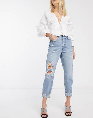 mid blue high rise mom fit ripped jeans