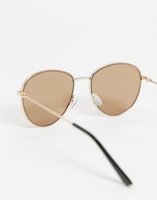River Island round sunglasses in gold | ASOS