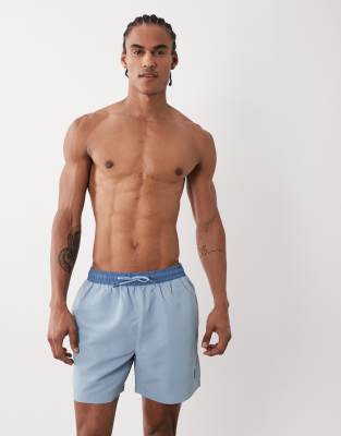River Island Rubber Badge Detail Swim Shorts In Blue