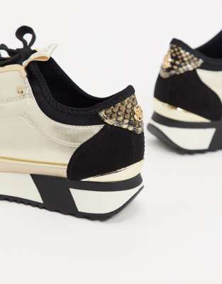 river island black and gold trainers