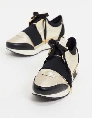 river island black and gold trainers