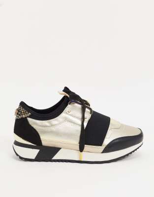 river island black and gold trainers