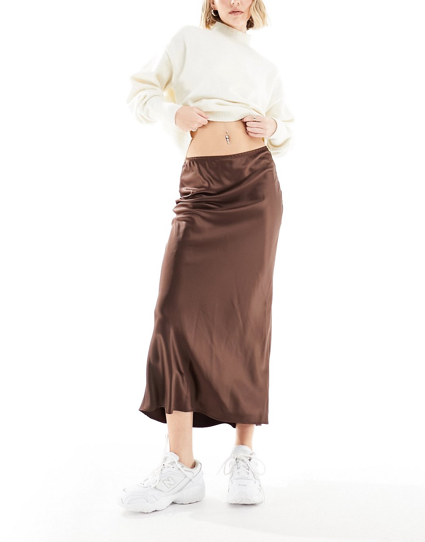Shop River Island Satin Bias Slip Skirt In Brown