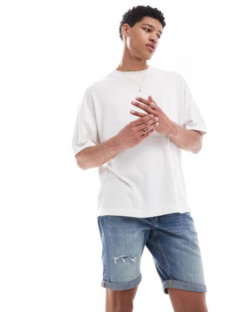 River Island – Schmal geschnittene Jeans-Shorts in mittelblauer Waschung - view 1