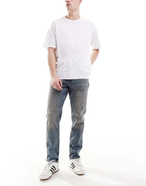 River Island – Schmal zulaufende Jeans in verwaschenem Mittelblau - view 1