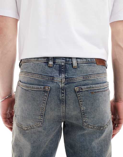 River Island – Schmal zulaufende Jeans in verwaschenem Mittelblau, 4 von 5