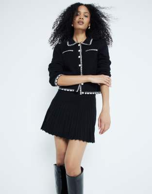 River Island - Schwingender Minirock in Schwarz