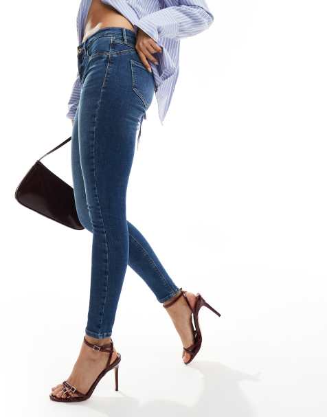 River Island sculpt midrise skinny jeans in midwash blue - view 1