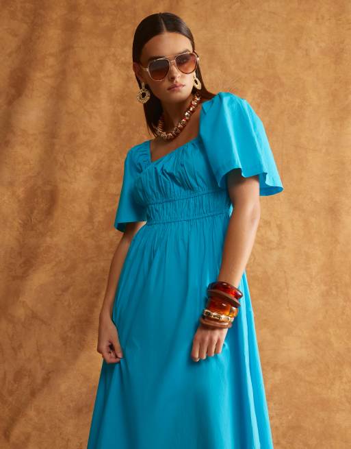 knee length dresses for ladies Rent Asos Design Halter Midaxi Dress With Shirred Bodice In Orange main image 0