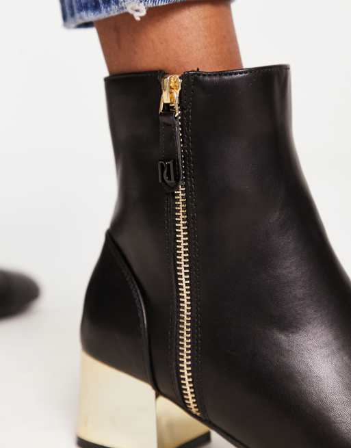 Black boots best sale with gold zipper