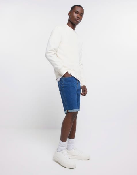 ASOS DESIGN shorter length denim shorts in 90s mid wash with rip