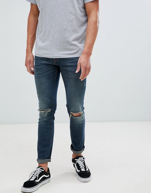 River Island skinny fit jeans with knee rips in mid wash blue | ASOS