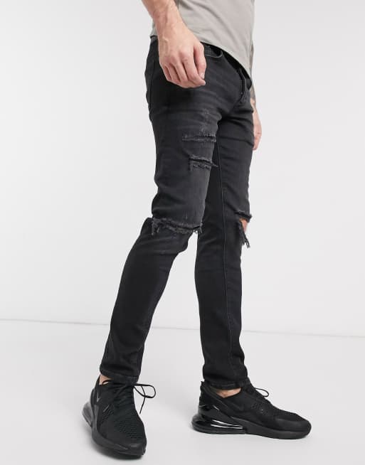 River Island – Skinny-Jeans in verwaschenem Schwarz mit Zierrissen