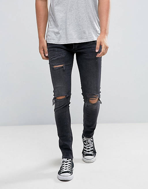 River Island skinny jeans with rips in black wash | ASOS