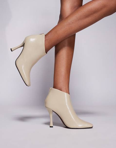 River Island slanted clean heel boots in cream - view 1