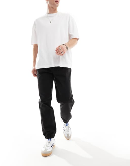 River Island slim fit trackies in black