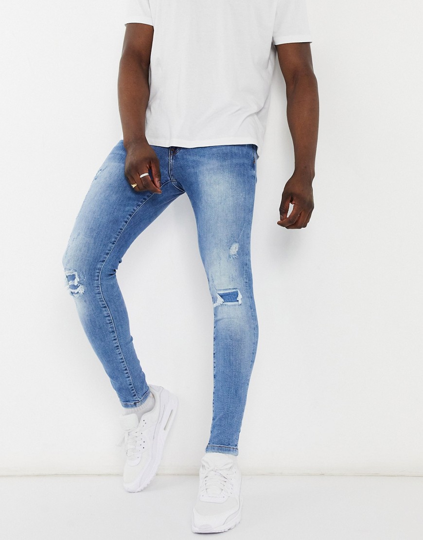 River Island spray on jeans with rips in light blue-Blues