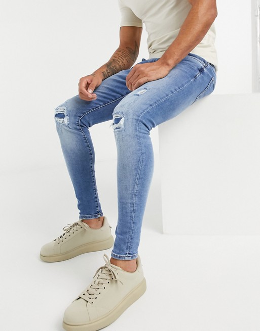 River Island spray on ripped jeans in midwash blue