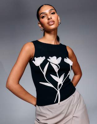 River Island - Strick-Trägertop in Schwarz mit Blumen-Applikation