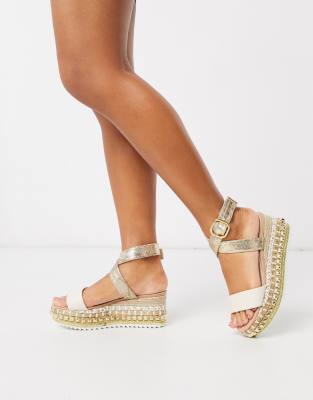 white studded flatforms