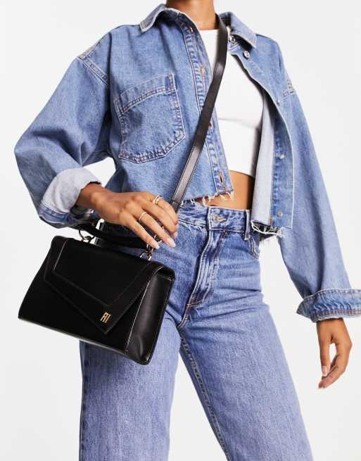 River Island – Svart asymmetrisk axelremsväska med viklock