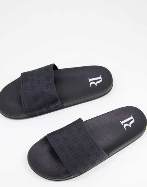 River Island – Svarta tofflor med präglad logga