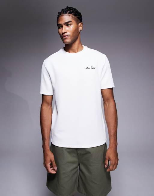 River Island – T-Shirt in Ecru mit aufgesticktem „Ame Saint“-Schriftzug